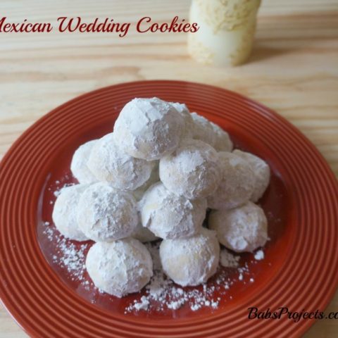 Mexican Wedding Cookies on a Red Plate