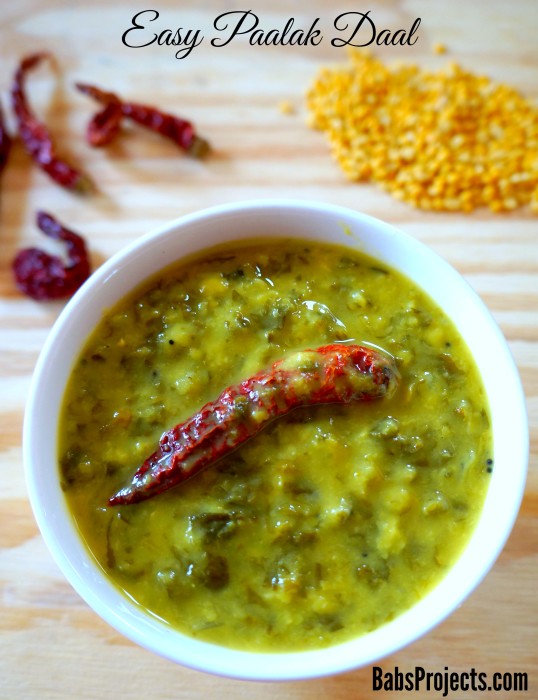 Paalak Daal in a White Bowl Garnished with a Red Chili