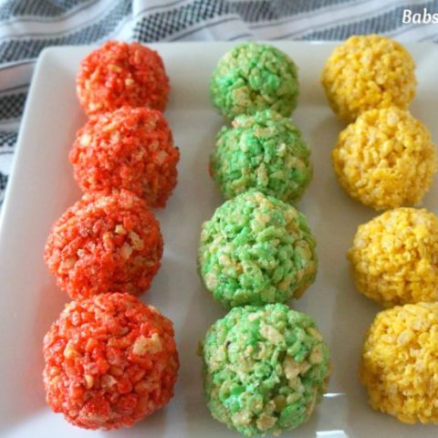 Rice Krispie Ladoo in Different Colors on a White Platter