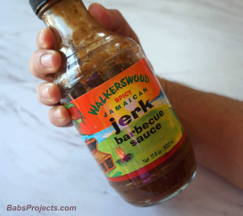 Bottle of Walkerswood Spicy Jamaican Baked Jerk Barbeque Chicken Wings Seasoning