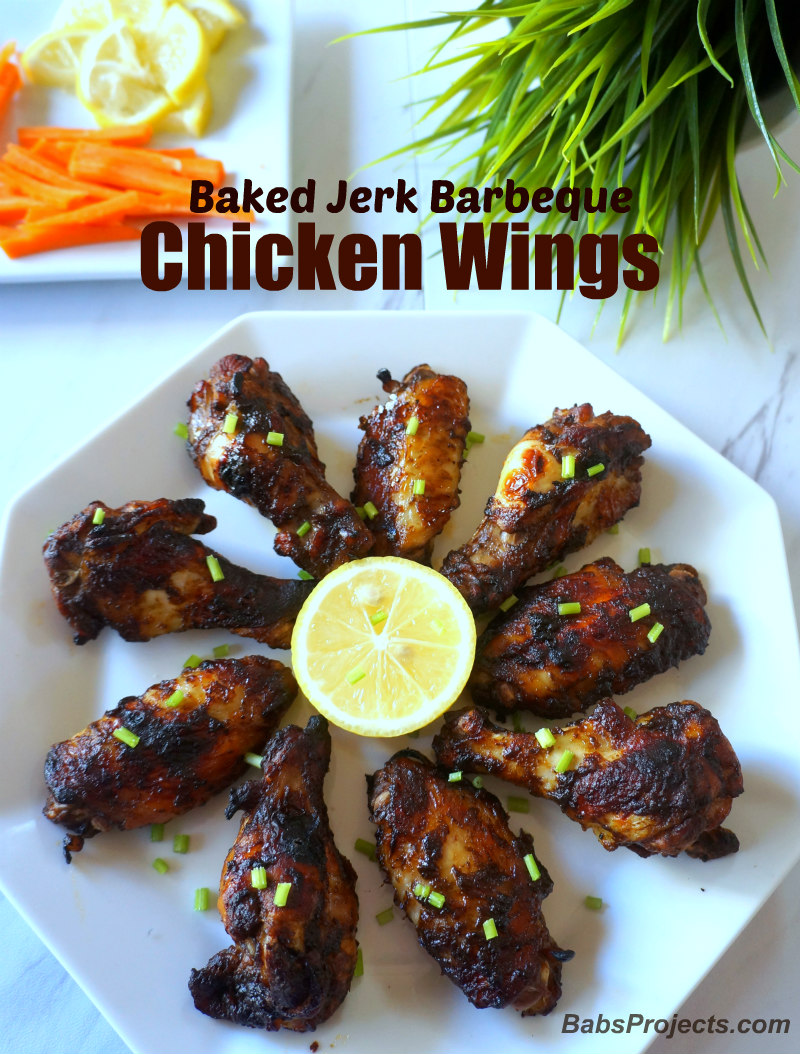 Baked Jerk Barbeque Chicken Wings with Sliced Carrots and Lemon