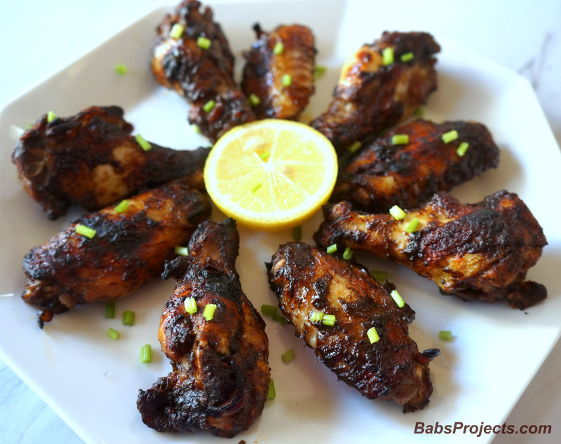 Baked Jerk Barbeque Chicken Wings With a Slice of Lemon