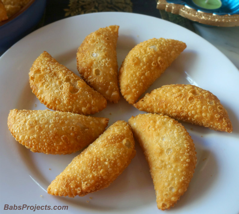 Close-up Shot of Karanji and Gujiyas on White Plate