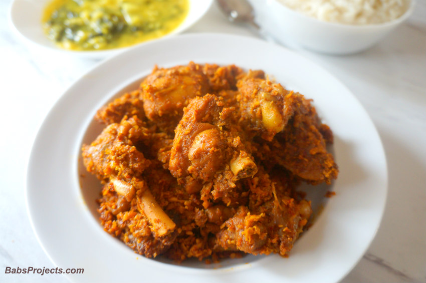 Coconut Chicken in a White Bowl with Rice on the Side