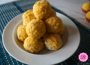 Boondi Ladoos on a While Bowl with Dark Blue Placemat