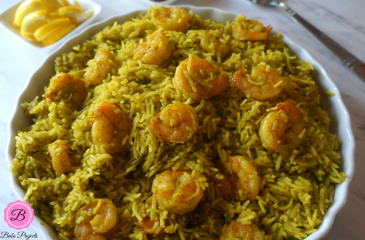 Green Masala Shrimp Pulao in a Pie Platter with Serving Spoon on the Side