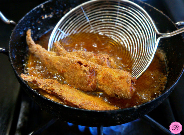 Crispy Fried Mandeli Being Deep Fried in Oil