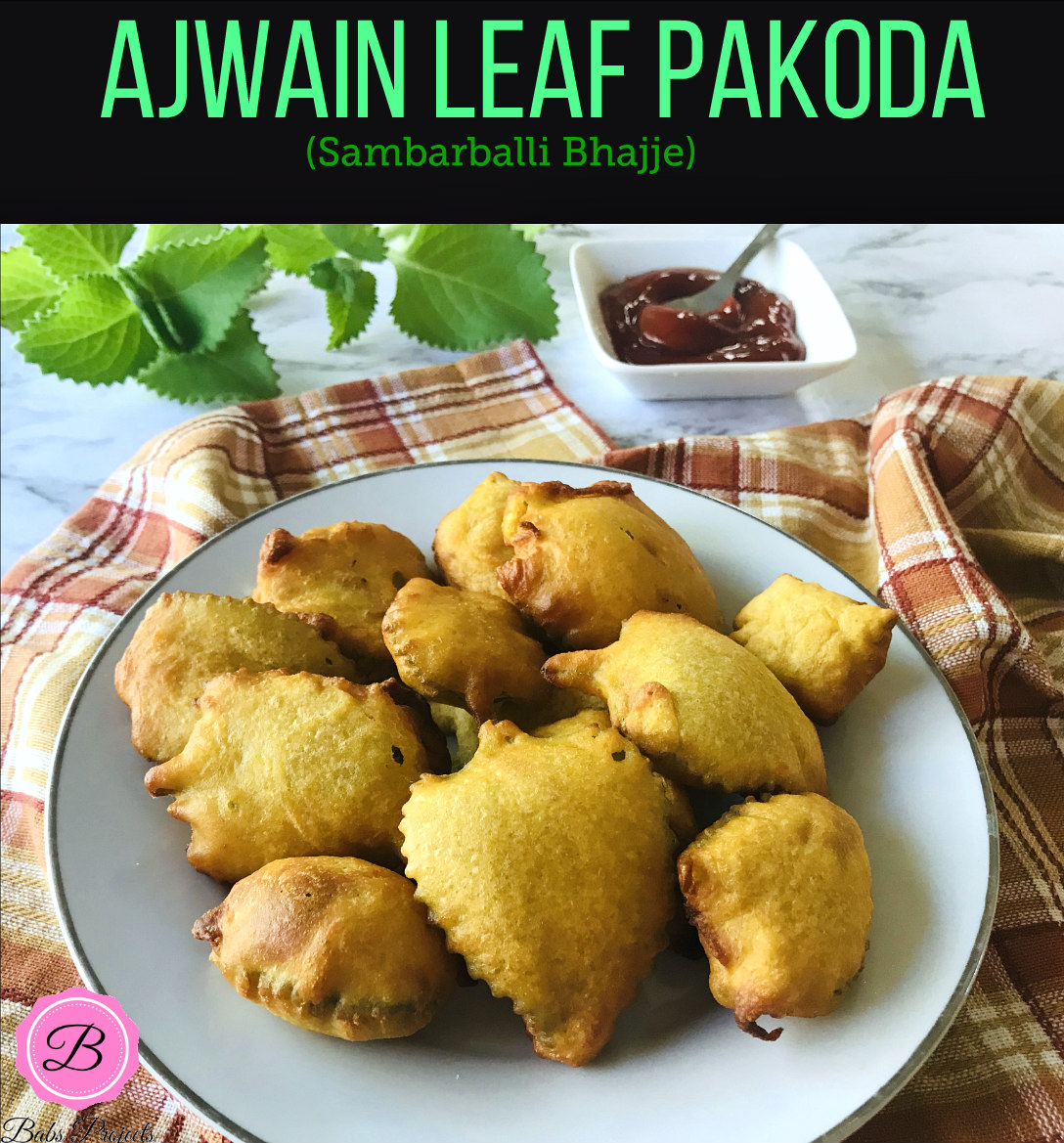 Ajwain Leaf Pakoda on a White Plate with Some Ketchup on Side.