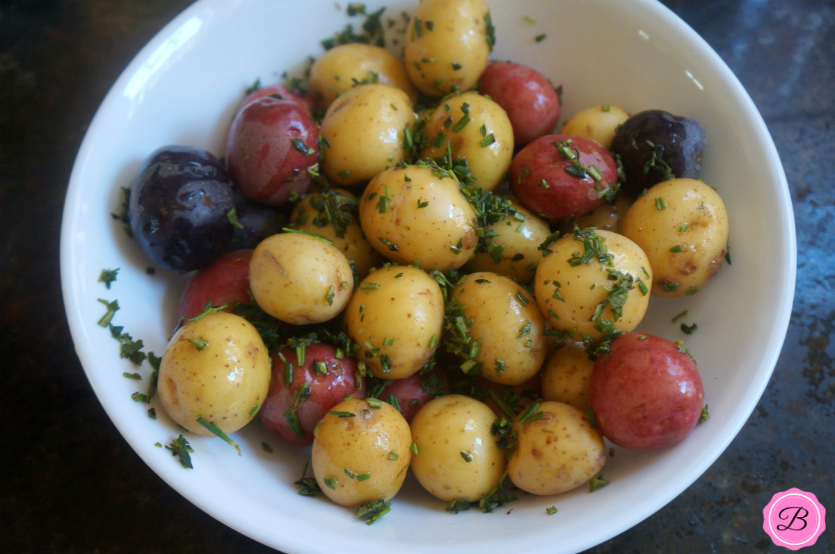Baby Potatoes with Herb Marinade in a White Bowl