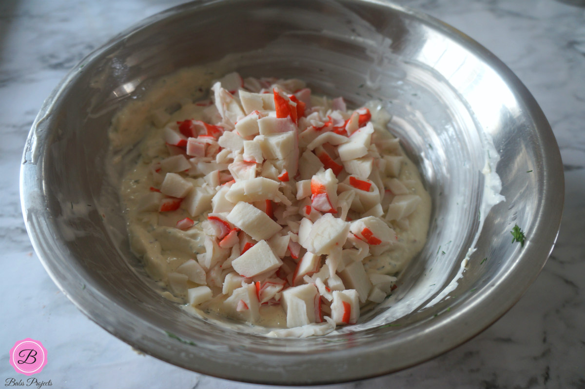 Pieces of Imitation Crab in a Stainless Steel Bowl