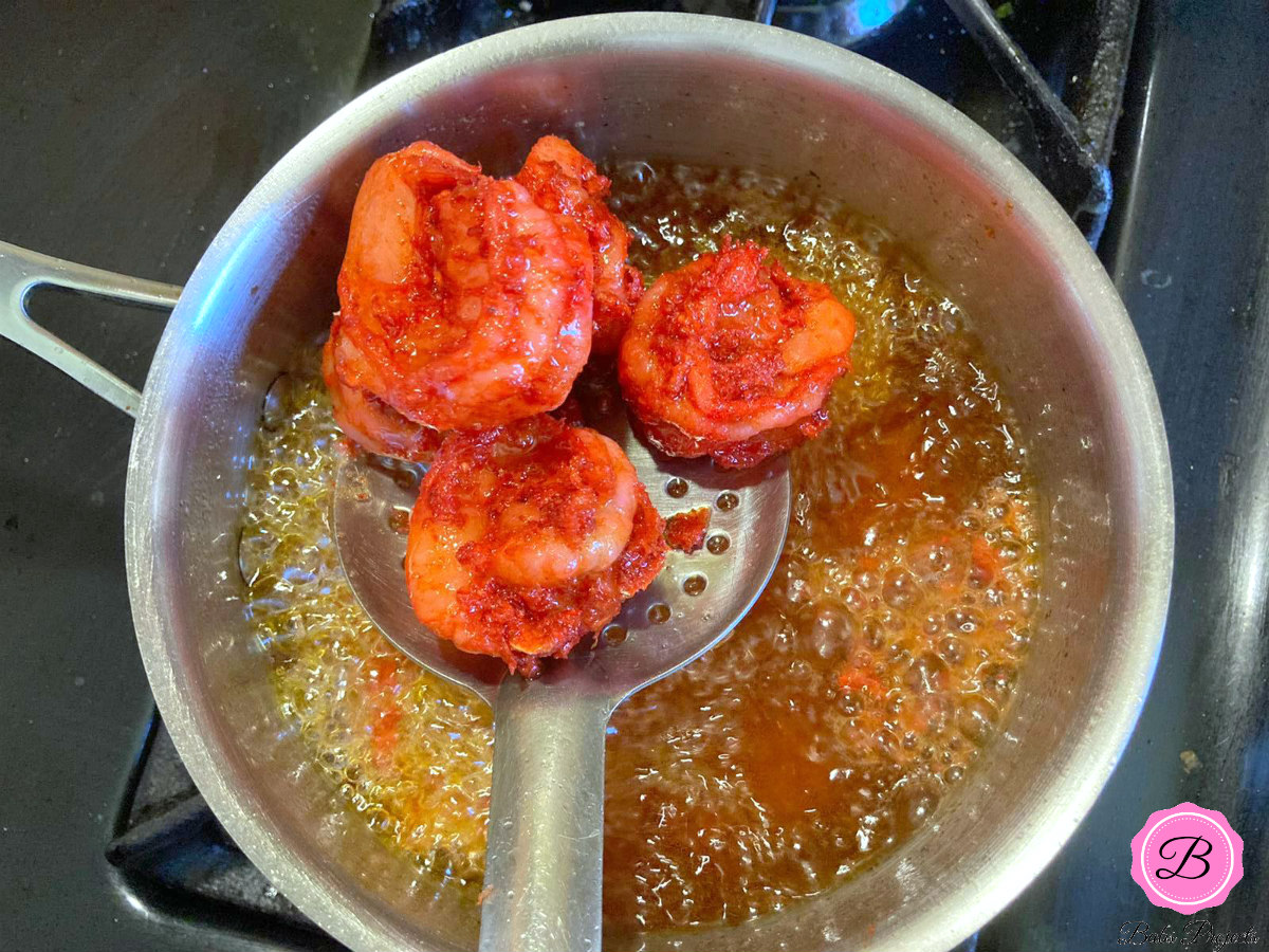 Fried Shrimp on a Stainless Steel Spoon