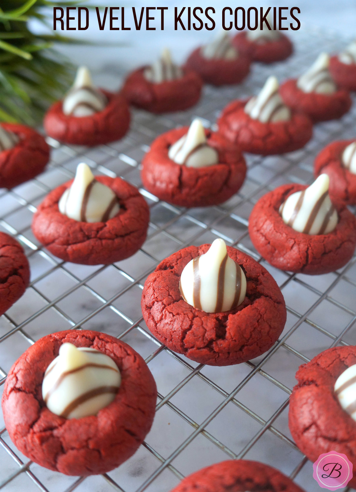 Red Velvet Kiss Cookies with Hershey's Kisses on a Cookie Sheet