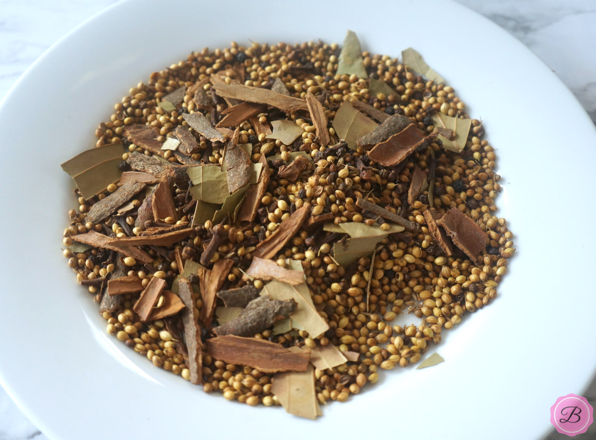 Mixed Whole Roasted Spices in a White Bowl