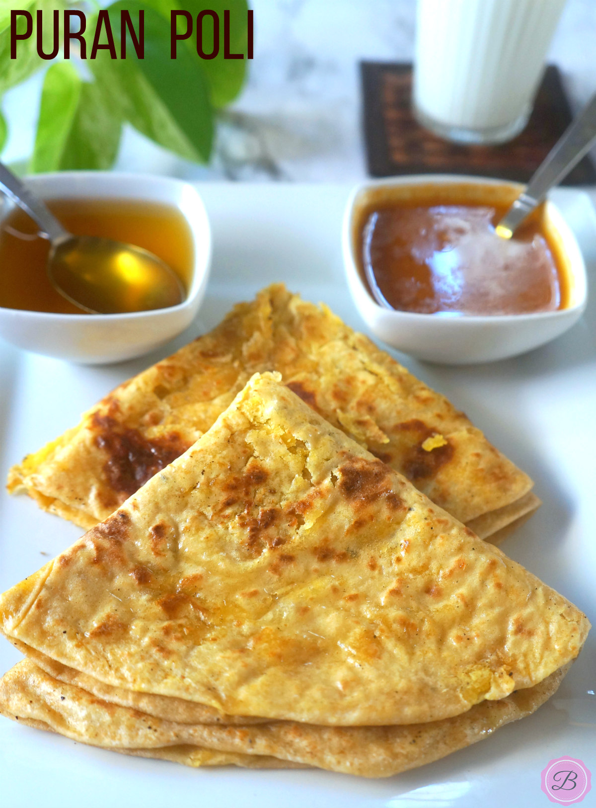 Two Puran Poli on a White Plate with Ghee and Katachi Amti on the Side