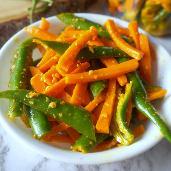 Carrot Green Chili Pickle in a White Bowl