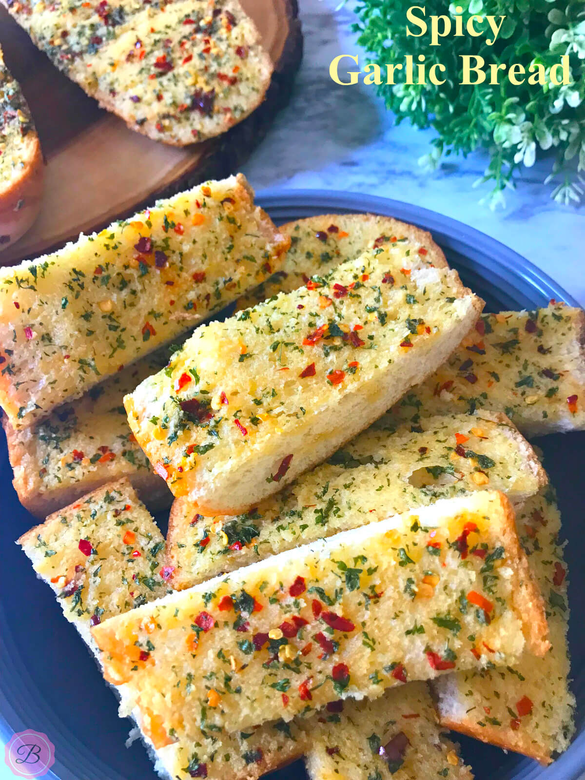 Slices of Spicy Garlic Bread in Blue Bowl