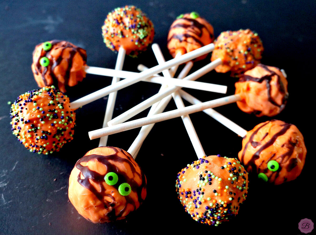 Orange Halloween Pops Decorated with Different Sprinkles