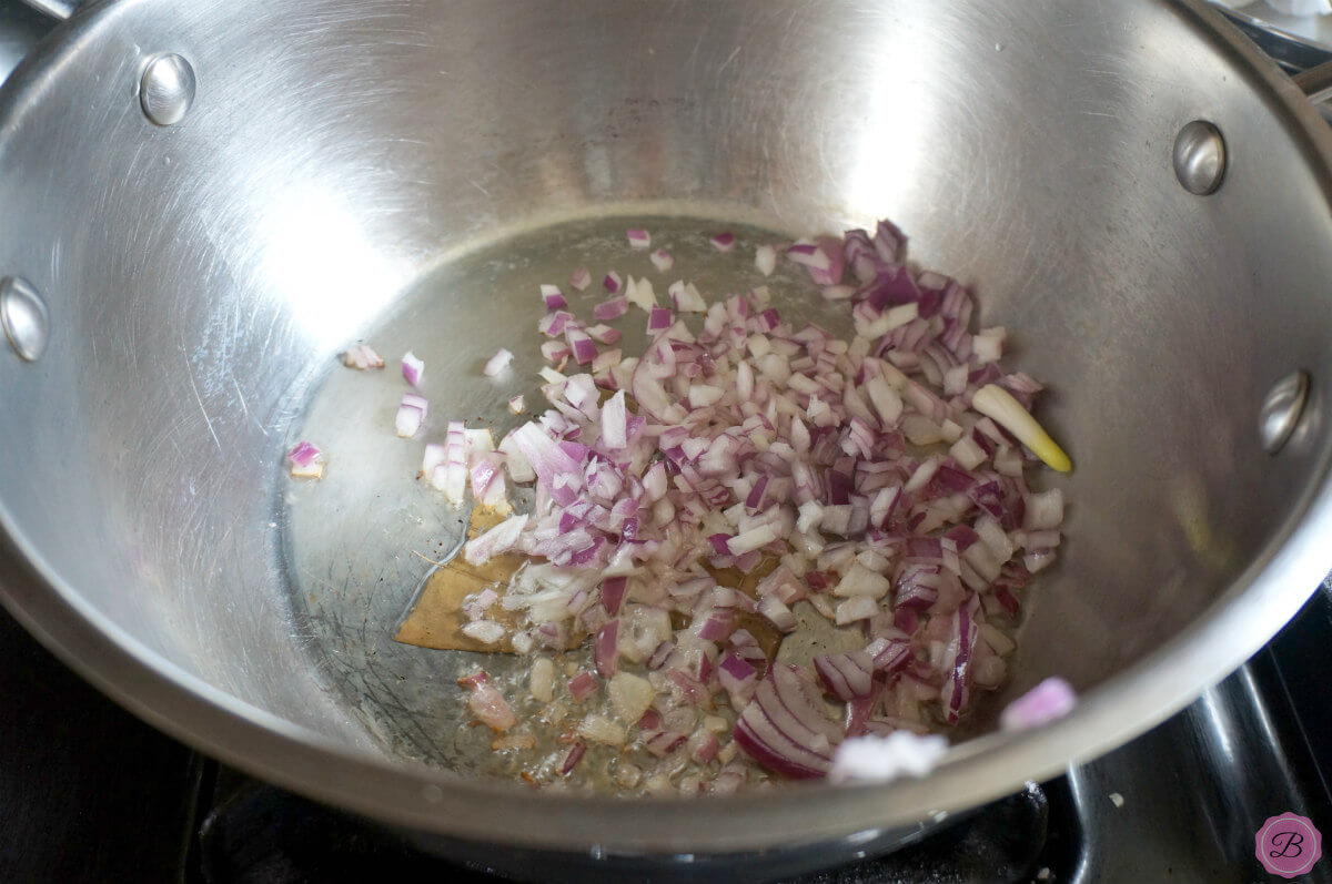 Onion Sauteeing in a Stainless Steel Pot