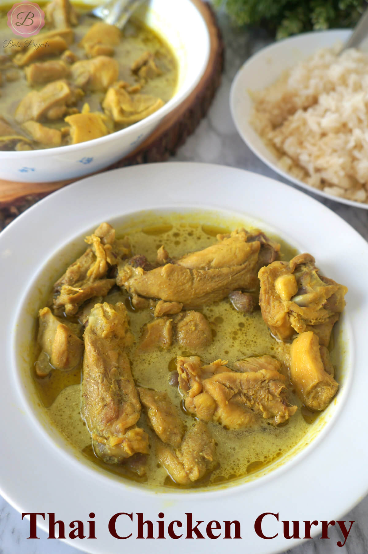 Thai Green Chicken Curry in a White Bowl with Rice on the Side