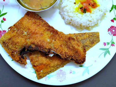 Deep Fried Sole on a Plate with Rice and Daal on the side