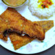 Deep Fried Sole on a Plate with Rice and Daal on the side