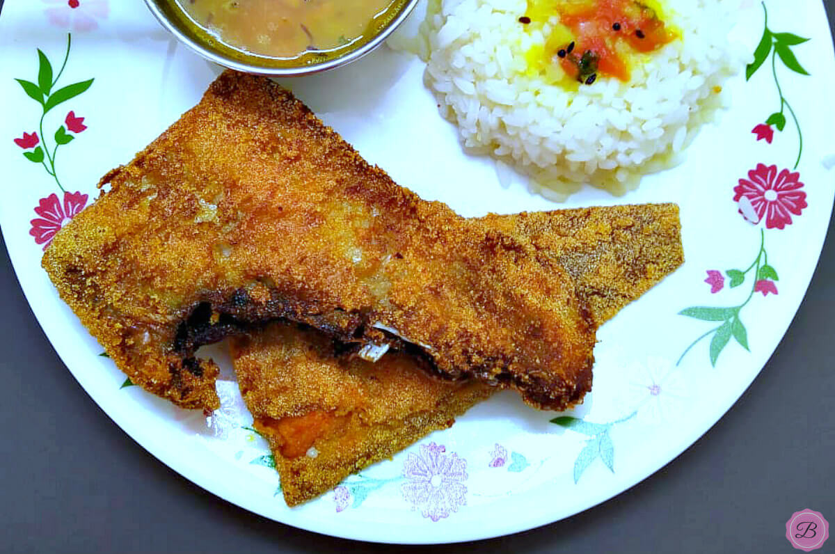 Deep Fried Sole on a Plate with Rice and Daal on the side