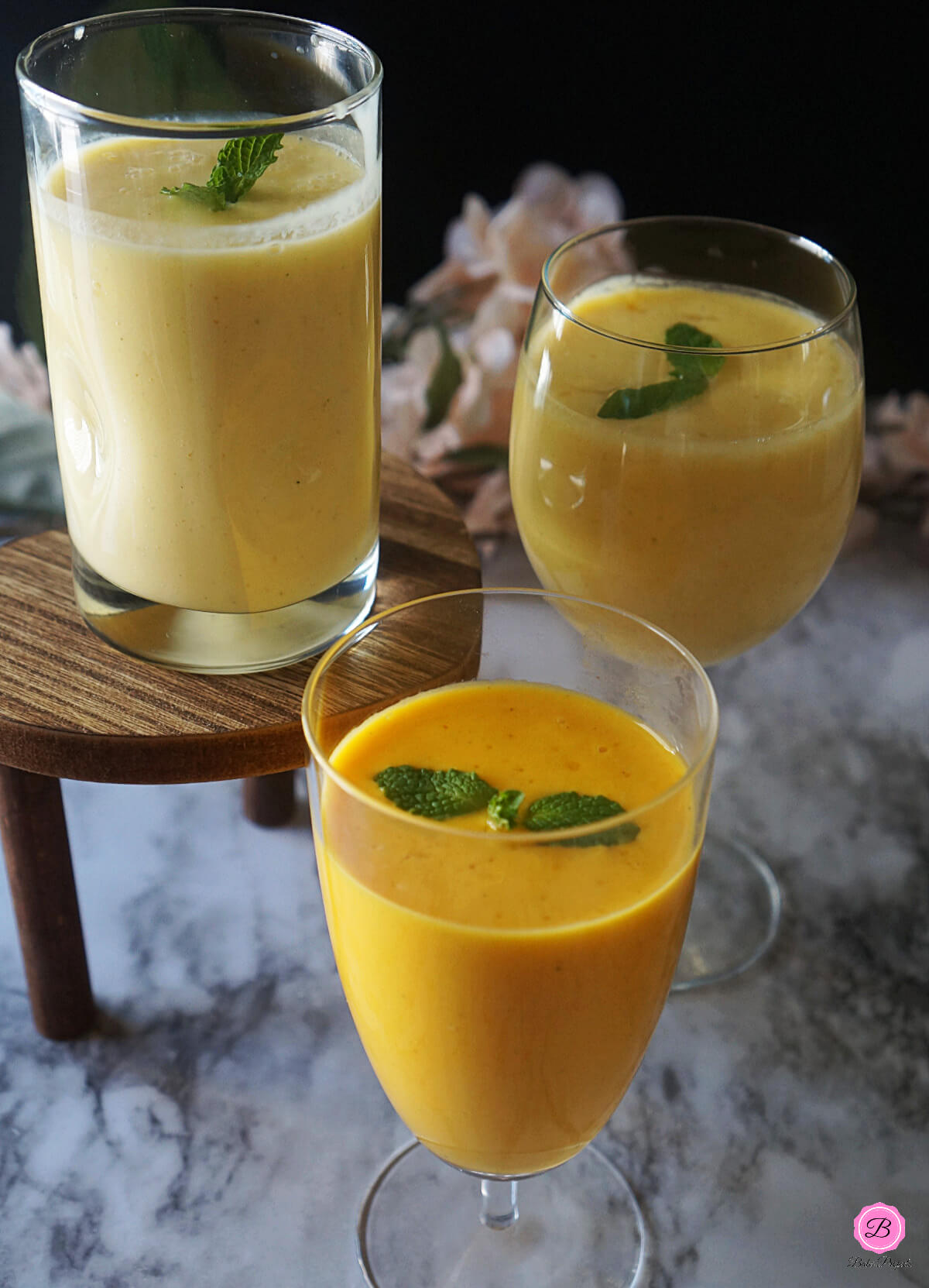 Close Up picture of Mango Lassi in 3 Different Glasses