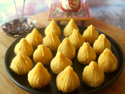 Close up Shot of Mango Modak Peda on a Black Platter