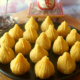 Close up Shot of Mango Modak Peda on a Black Platter