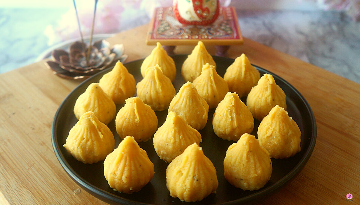 Close up Shot of Mango Modak Peda on a Black Platter