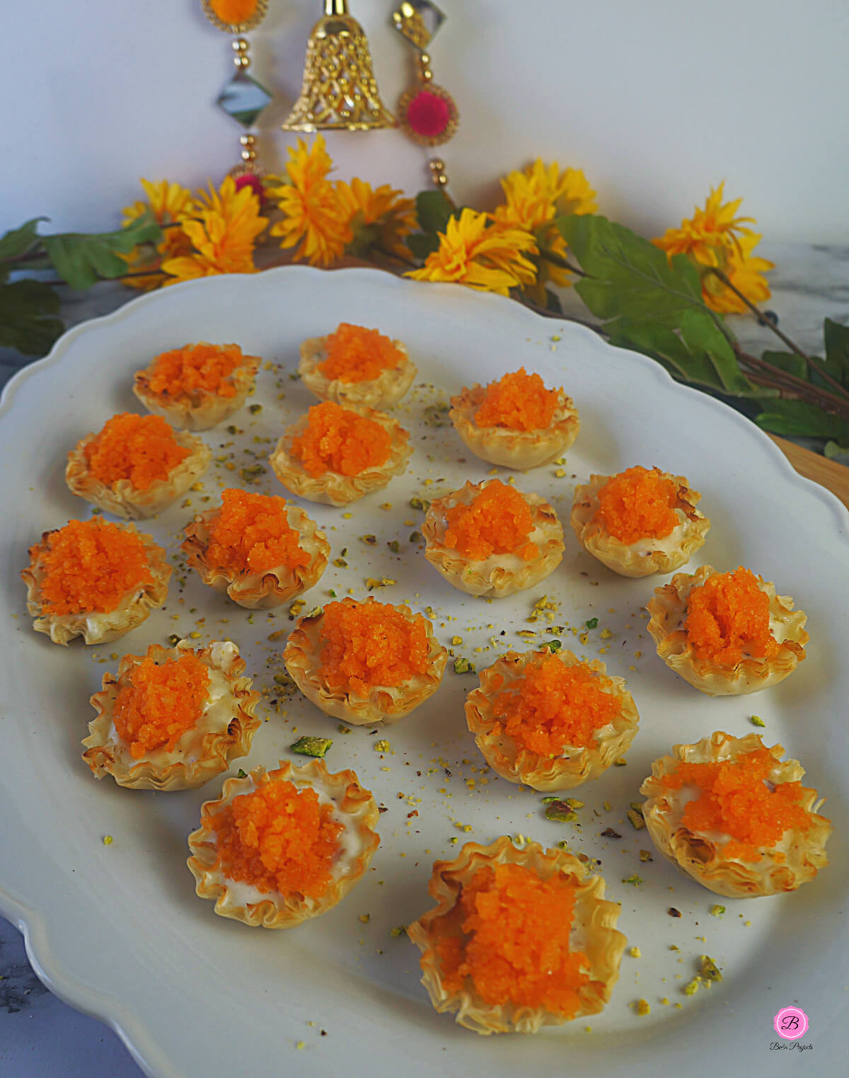 Rabdi Bites Phyllo Cups Dessert Arranged on a White Oval Platter